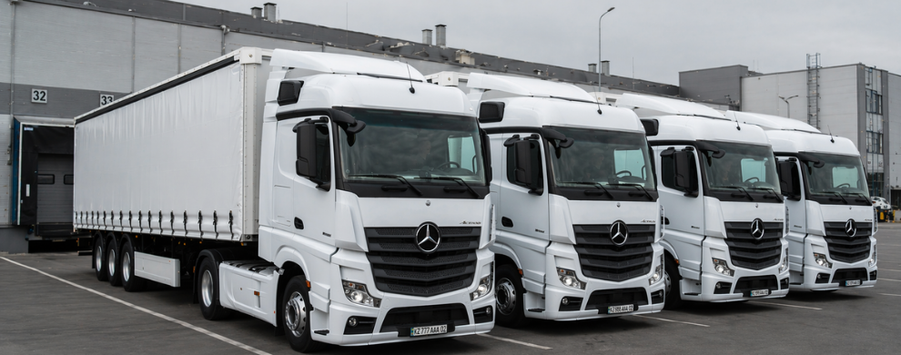Dealti trucks positioned at loading ramp in Kazakhstan logistics yard